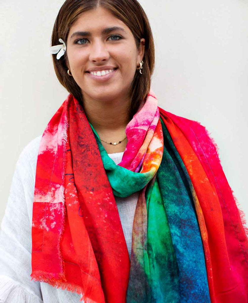 Young brown hair green eyes woman, wearing multi-coloured scarf with original art design